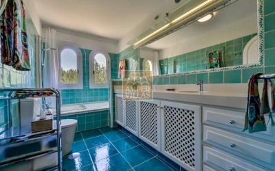 A beautiful villa in a peaceful, green setting.